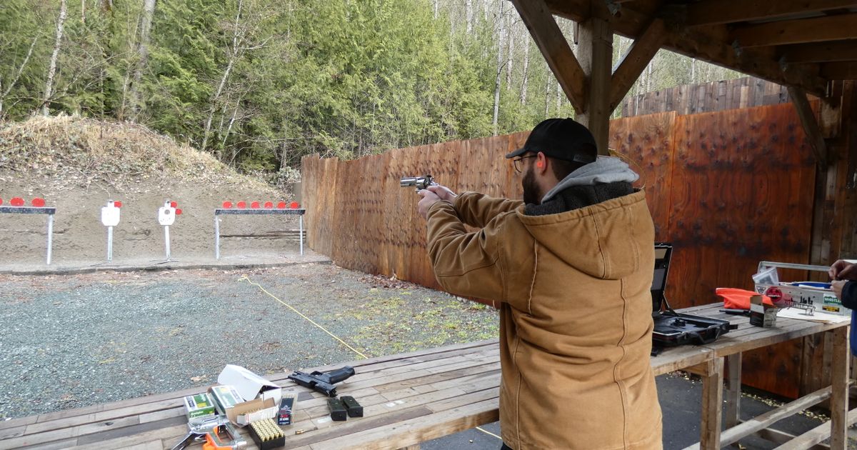 A man at an outdoor shooting range